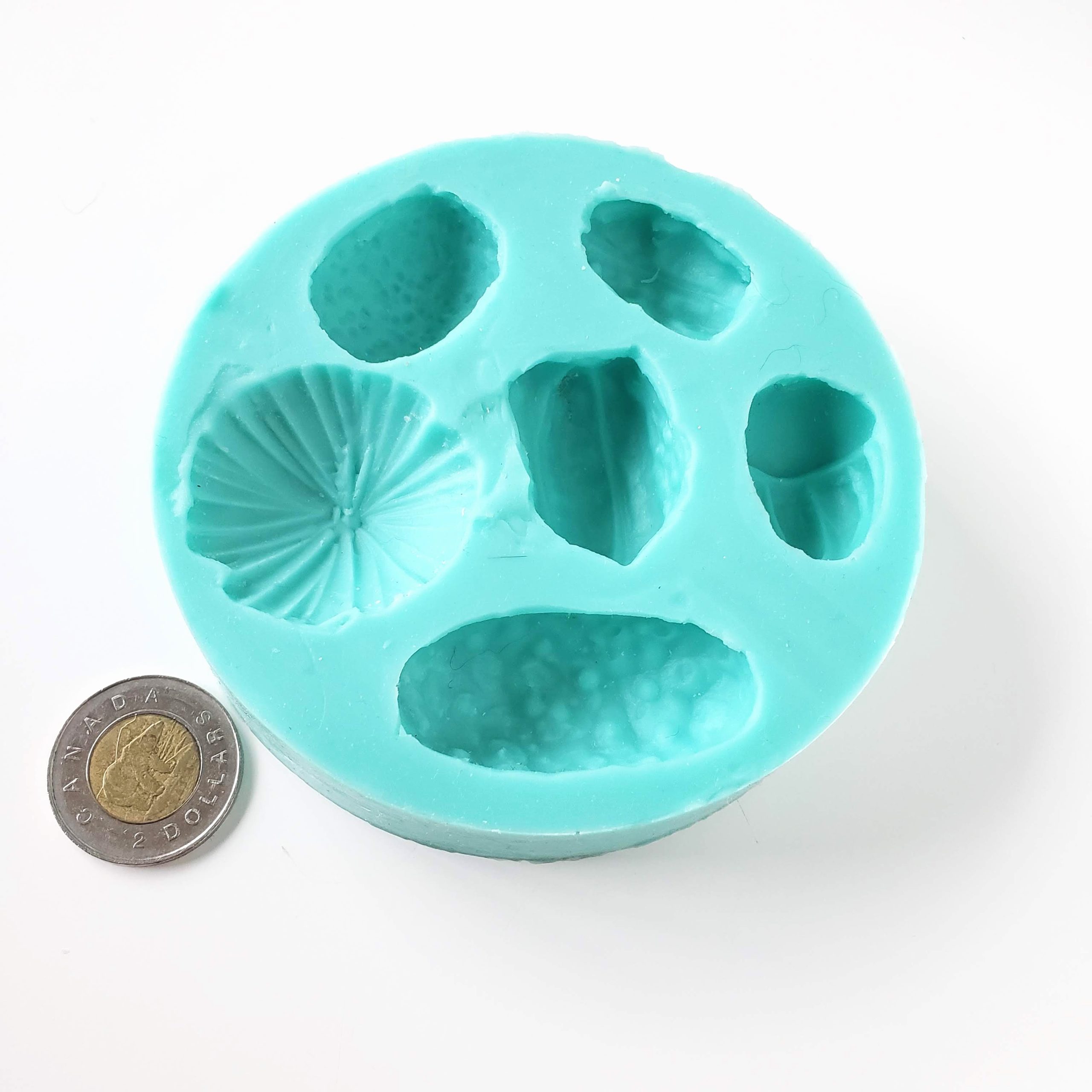 Flexible silicone bead molds for clay jewelry makers. Several designs in each mold. Can be used with resin.