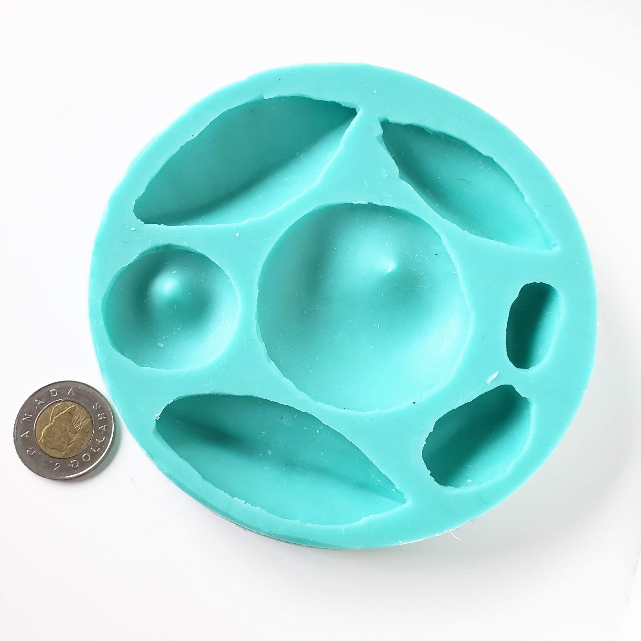 Flexible silicone bead molds for clay jewelry makers. Several designs in each mold. Can be used with resin.
