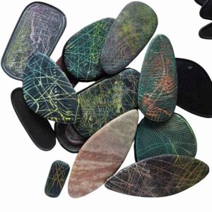 several polymer clay pieces made using the cabezel canvas fragments series