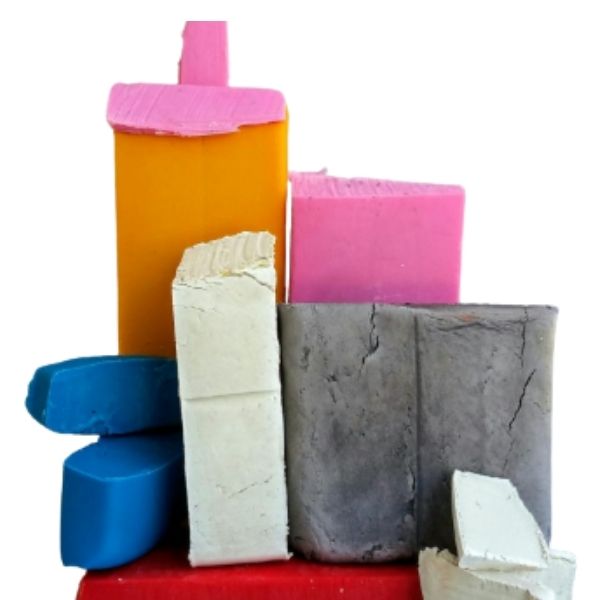 Various colours and blocks of polymer clay shown stacked.