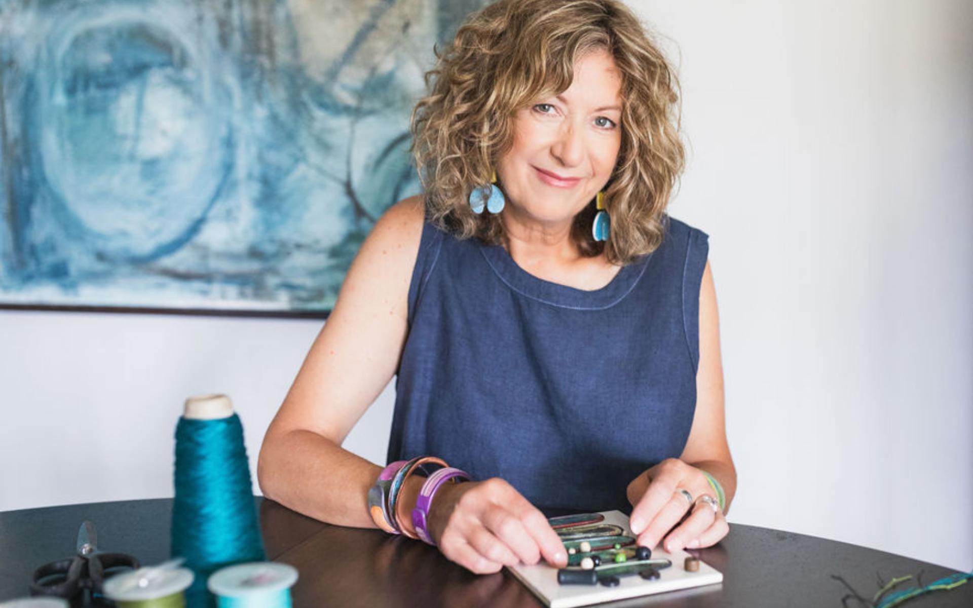 image of the artist working at a table