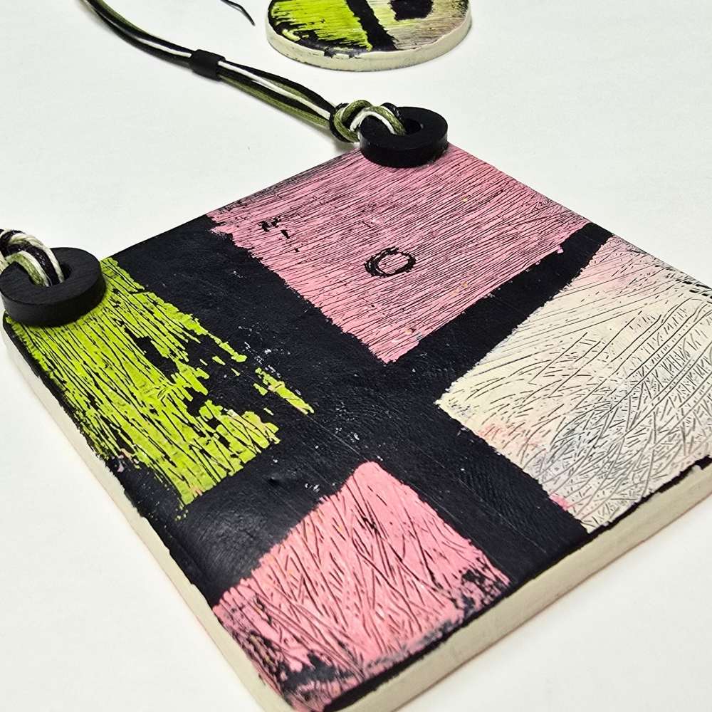 example of element from the workshop using polymer clay and scratched paint technique