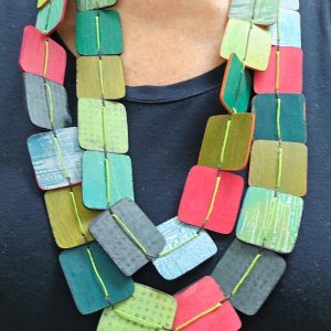 hand painted wood necklace on model